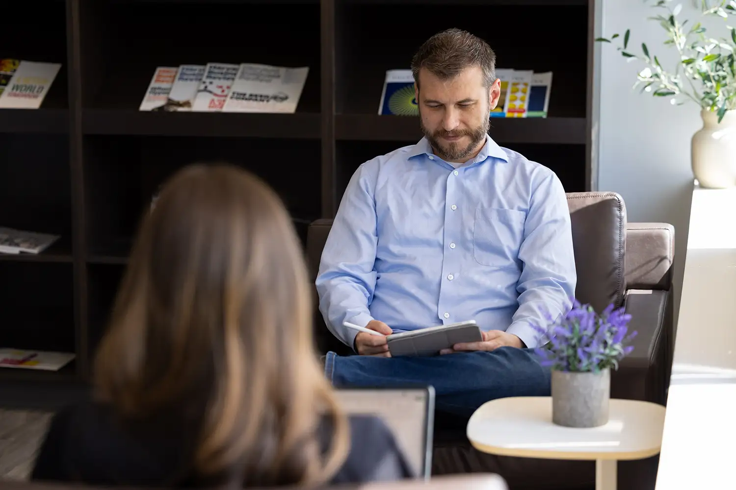 Customer success managers discussing the implementation of customer success playbooks