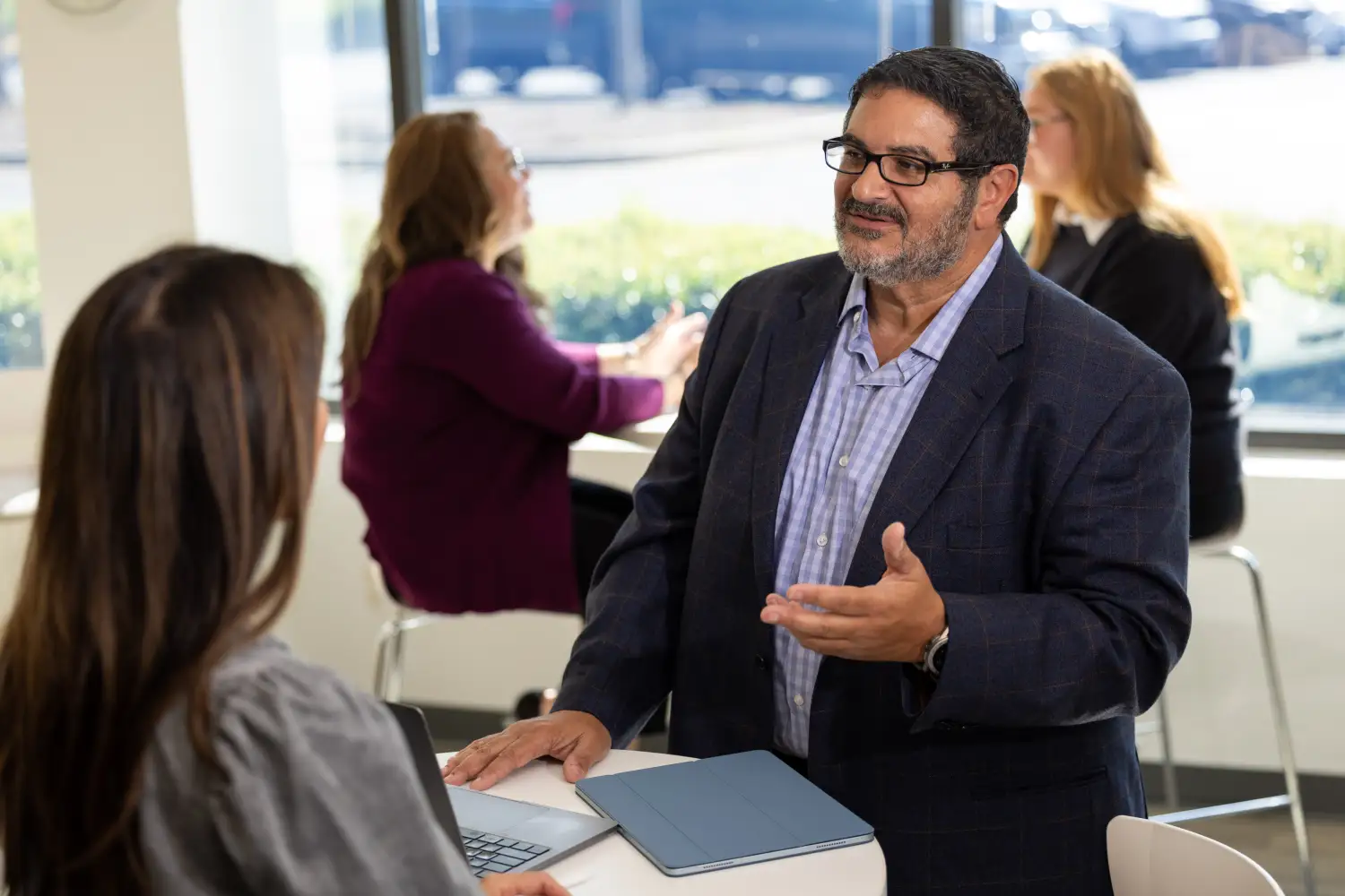 Manager explaining how a unified Salesforce-native PSA software improves business processes