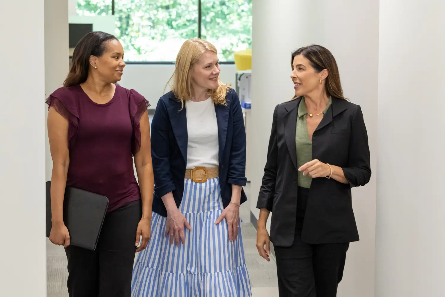 Finance leaders discussing unifying financial and CRM data with a Salesforce-native Financial Management solution