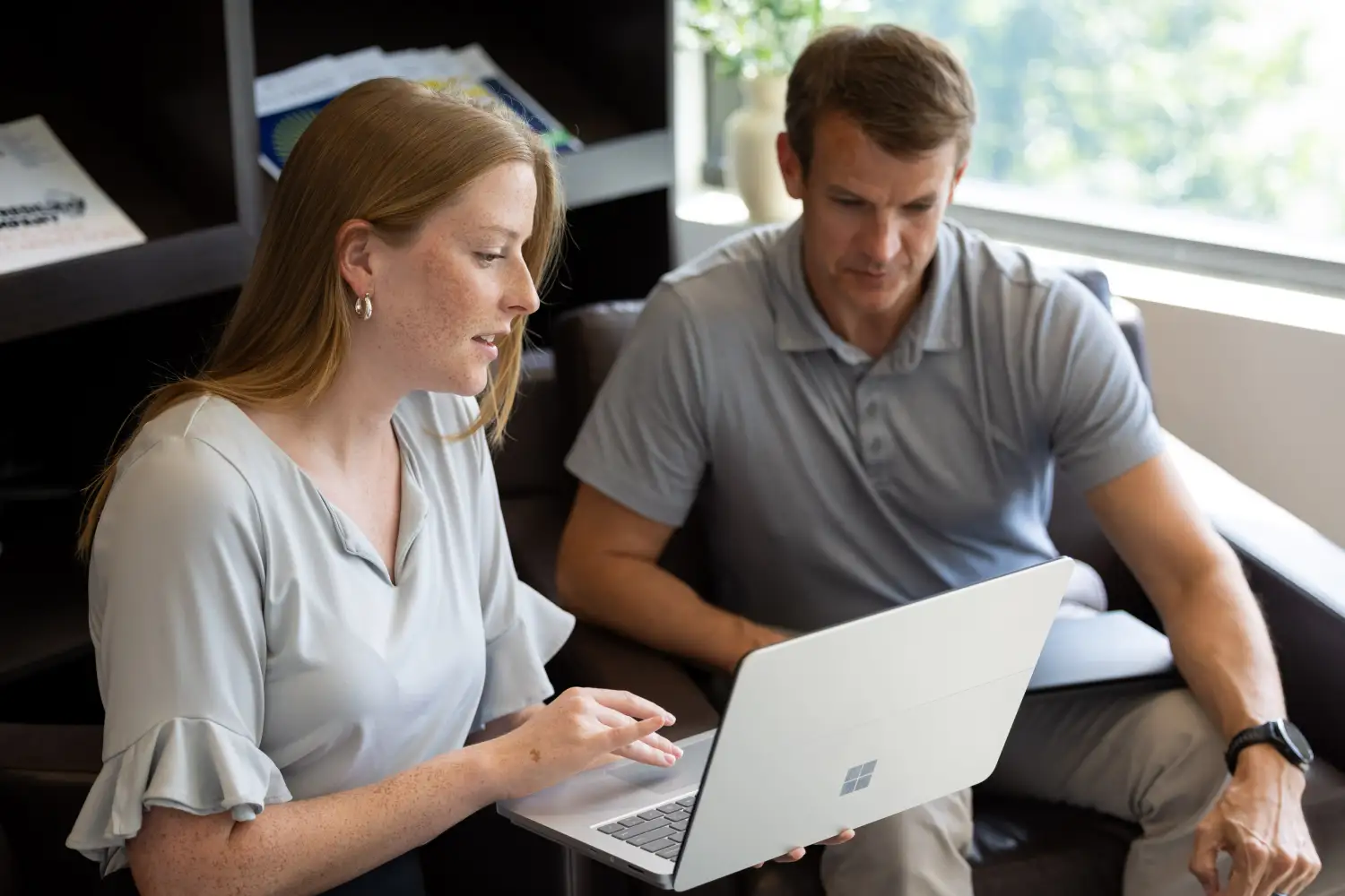 Professionals discussing resource management and billing automation with Certinia PS Cloud.